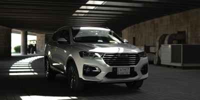 a white sports utility vehicle on the brick road