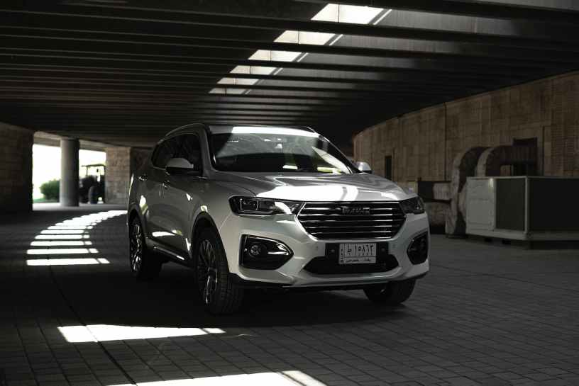 a white sports utility vehicle on the brick road