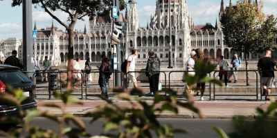 a city with a large building in the background