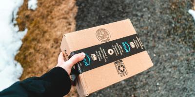 package from amazon prime carried by the delivery man