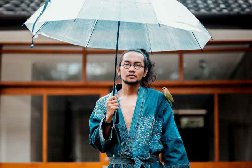 man holding umbrella