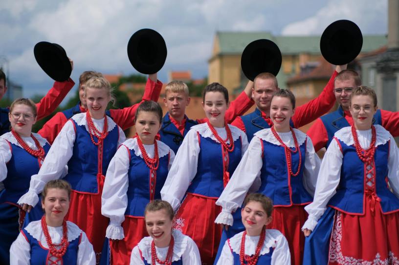 group in traditional polish folk costumes outdoors